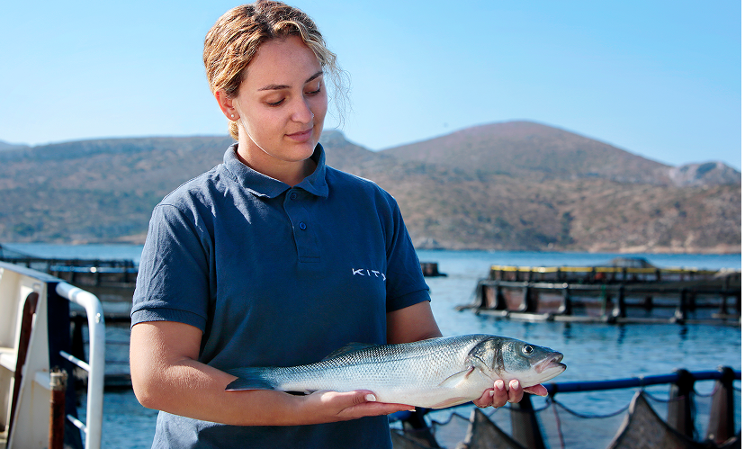 KITO team member holding fish